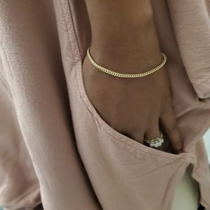 Mauve colored loose fitting peep shoulder blouse